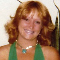 Tara Copeland Smiling woman with strawberry blonde hair